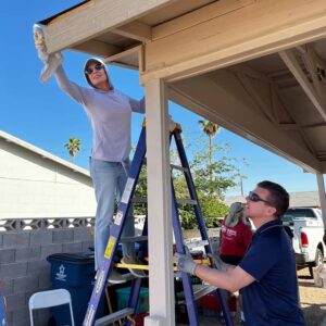 A Brush with Kindness volunteers work on a house