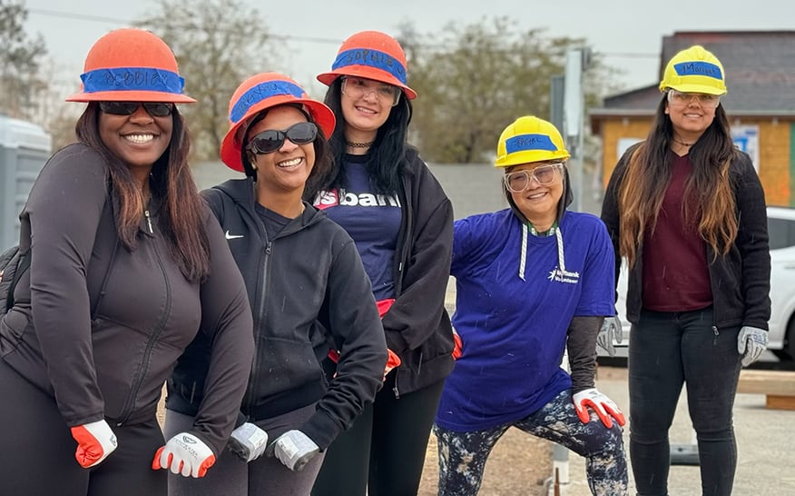 Five women at a home build