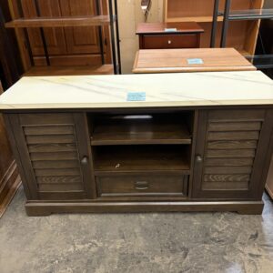 Dark wood cabinet with a marble top, open shelves in the center, and closed louvered doors on each side.