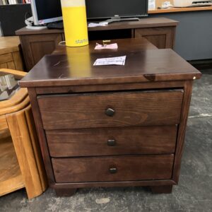 A dark wood three-drawer nightstand with dark square knobs.